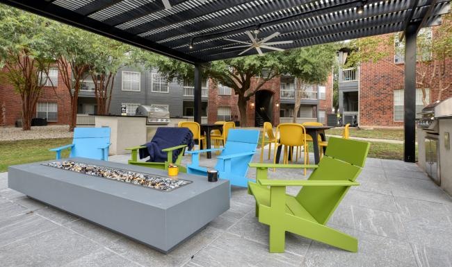 a patio with chairs and tables