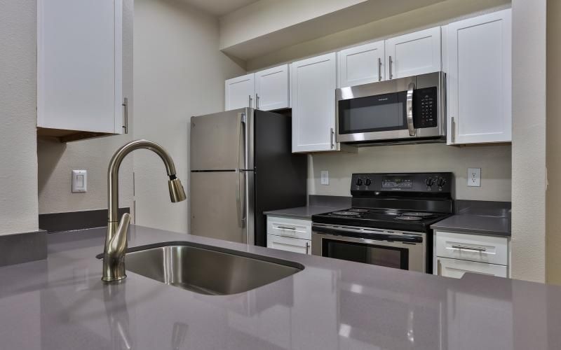 a kitchen with white cabinets